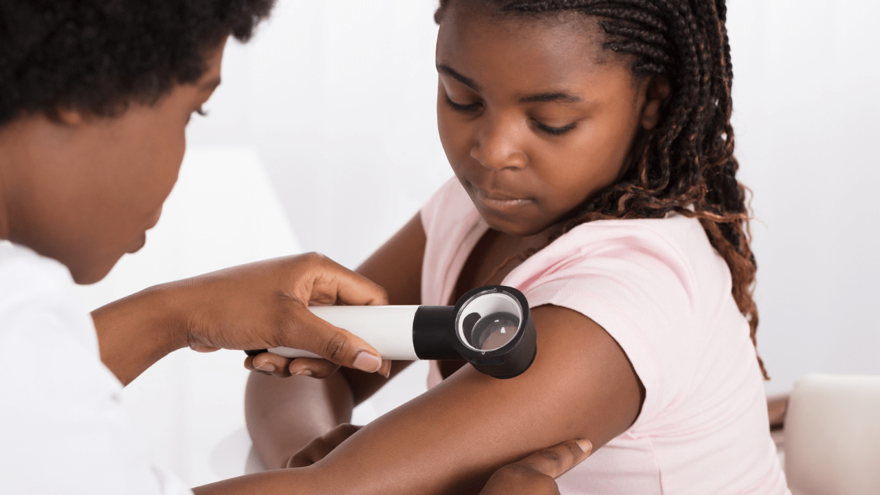 young girl at the dermatologist