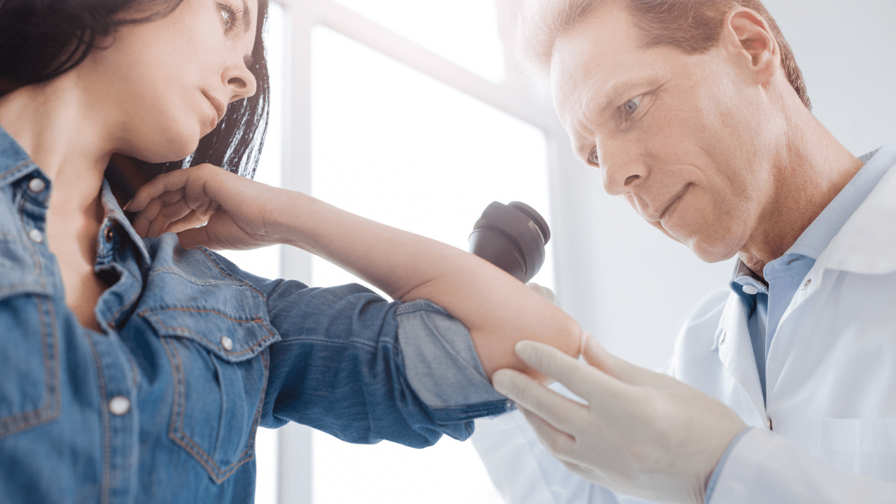 doctor examining a woman's arm