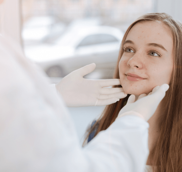 young girl at the dermatologist